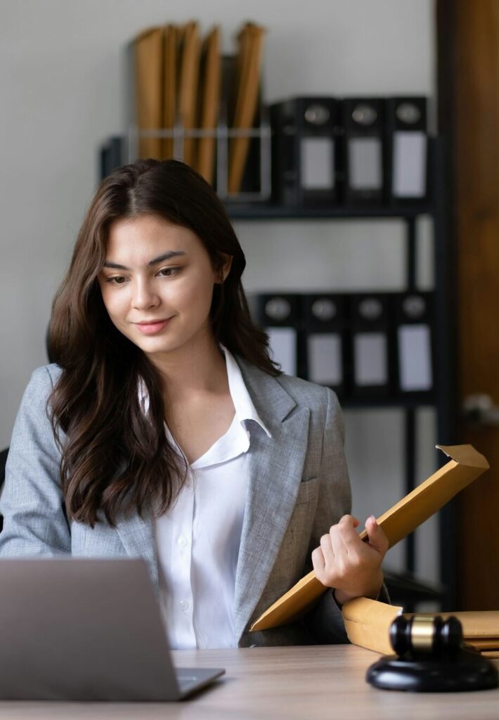 Asian lawyer woman working with a laptop computer in a law office. Legal and legal service concept.